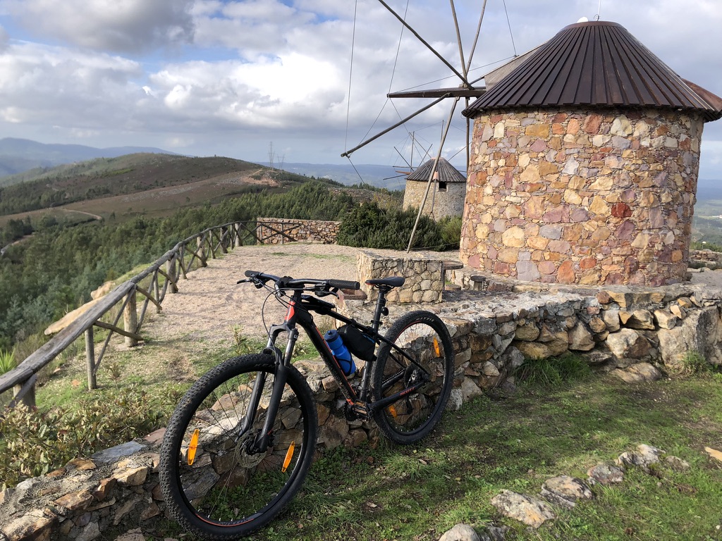 bike in front of old stone windmill - Moinhos da Serra da Atalhada