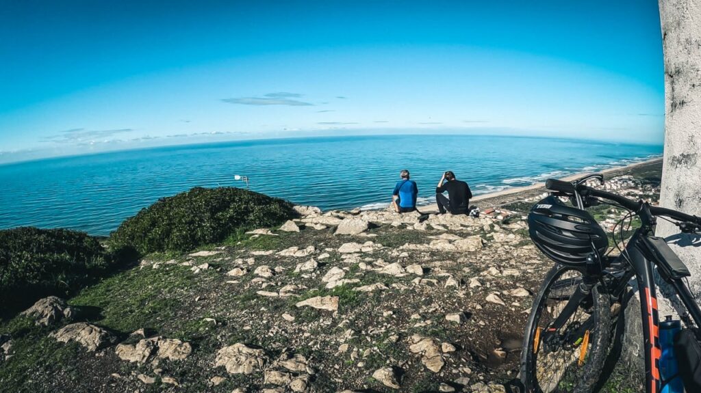 to riders on the top of viewpoint above Atlantic ocean